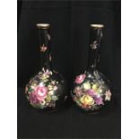 A pair of floral on a black ground vases