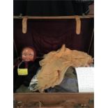 A Vintage suitcase packed with dolls and performance clothes and one doll. All handmade along with