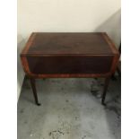 An Edwardian drop leaf table with drawer