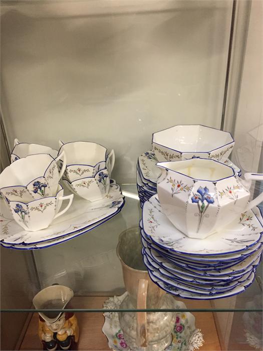 A hand painted Shelley tea service to include two service plates, twelve sandwich plates, twelve