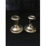 A pair of silver candlesticks