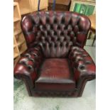 A leather button back tub chair
