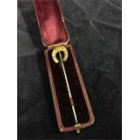 A horseshoe lapel pin stamped 18ct Total weight 4.4g in original leather box