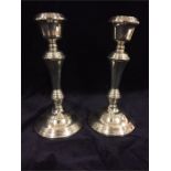 A pair of silver candlesticks hallmarked Birmingham 1973/74 215mm tall