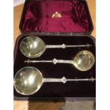 A boxed set of silver serving spoons and sugar sifter in original box by WW Logan