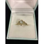 A 9ct gold diamond and aquamarine ring