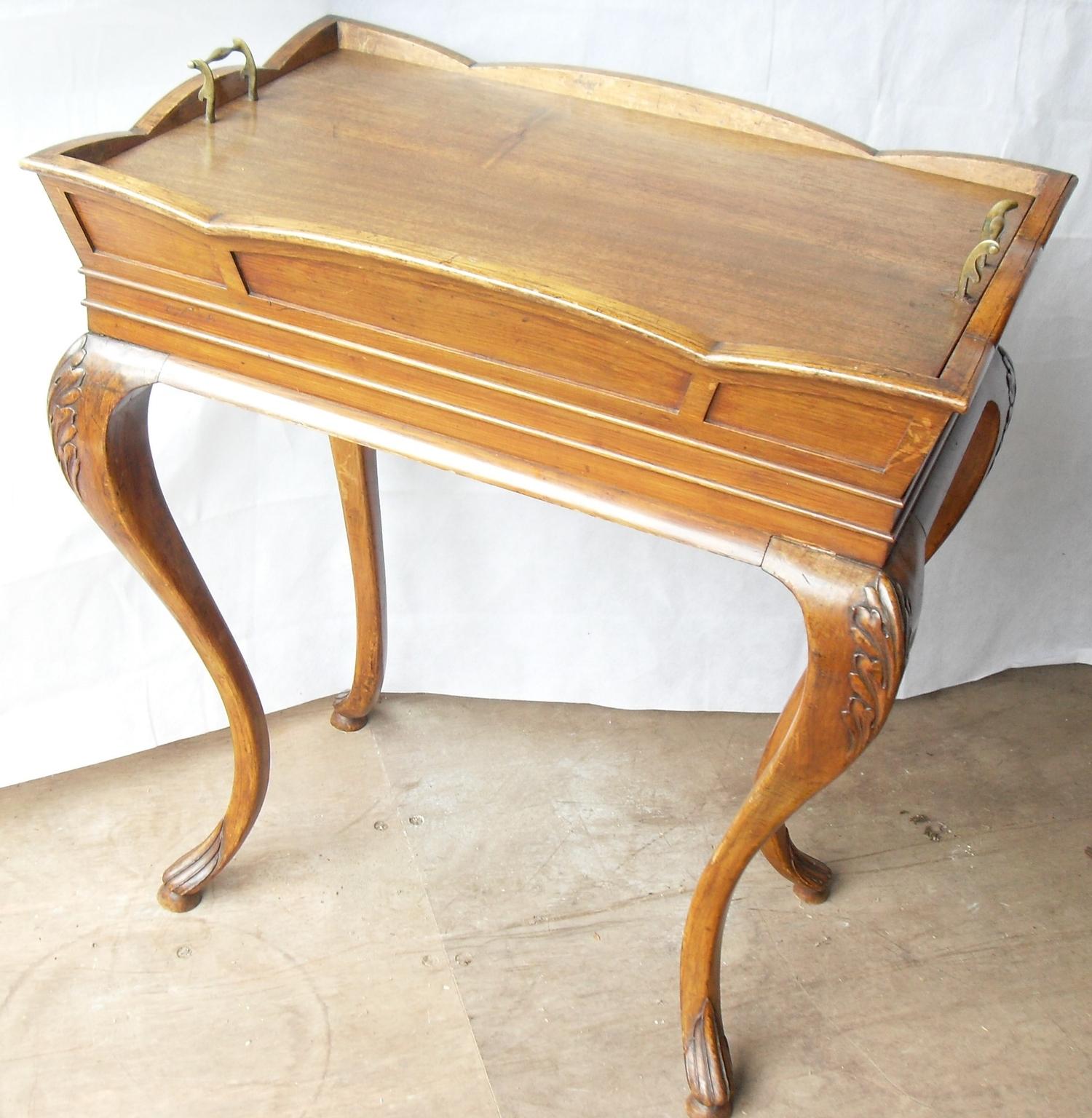 A 19th century walnut dining room cooler with removable top, lead-lined insert on carved cabriole