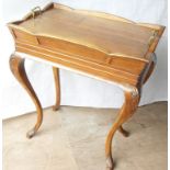 A 19th century walnut dining room cooler with removable top, lead-lined insert on carved cabriole