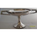 An eclectic lot to include a Walker & Hall silver plated Art Deco tazza a silver plated WW1 food
