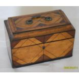 A Regency rectangular tea caddy composed of contrasting mahogany and satinwood with string inlay