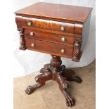 A 19th century lady's work table or lamp stand with three drawers under, brass handles, pilaster