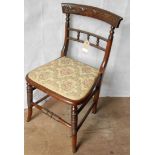 A late 19th century Continental-style oak-stained occasional chair with floral carving to top