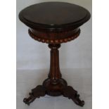 A William IV rosewood tea poy with shaped circular lift-up lid revealing a fitted interior on a