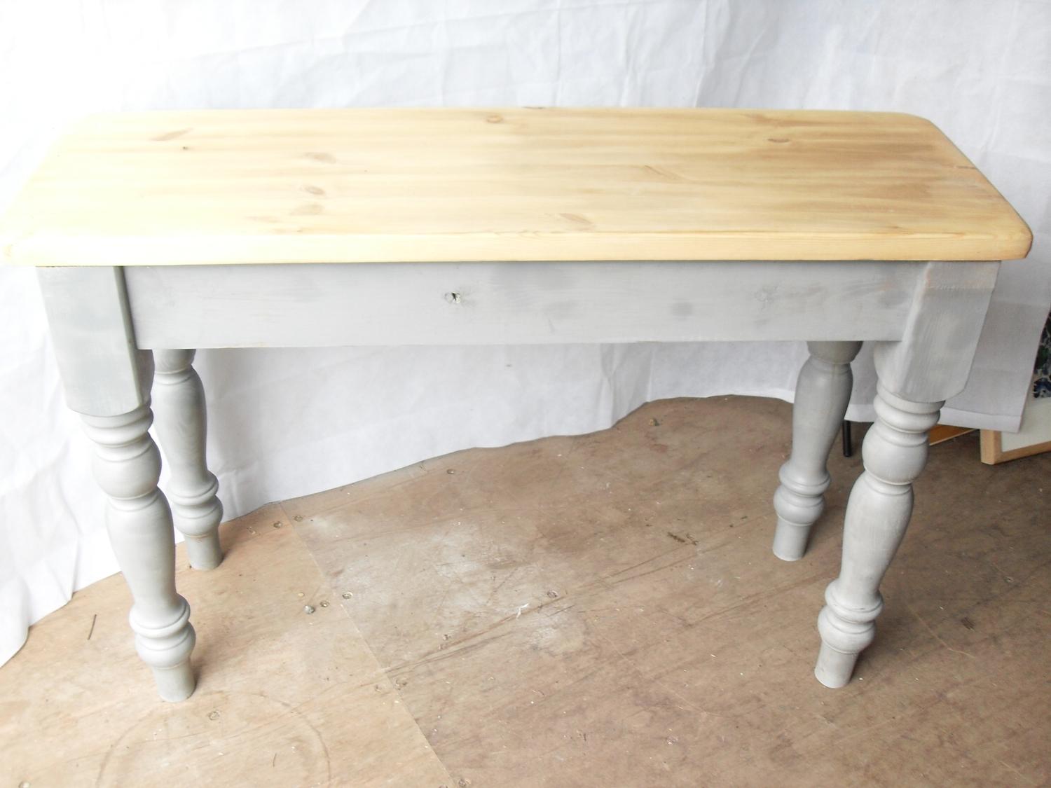 A rustic pine console table with painted frieze and turned legs, 77 x 116 x 39 cm