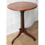 A Regency mahogany circular occasional table with rope-twist and carved support on tripod base 73