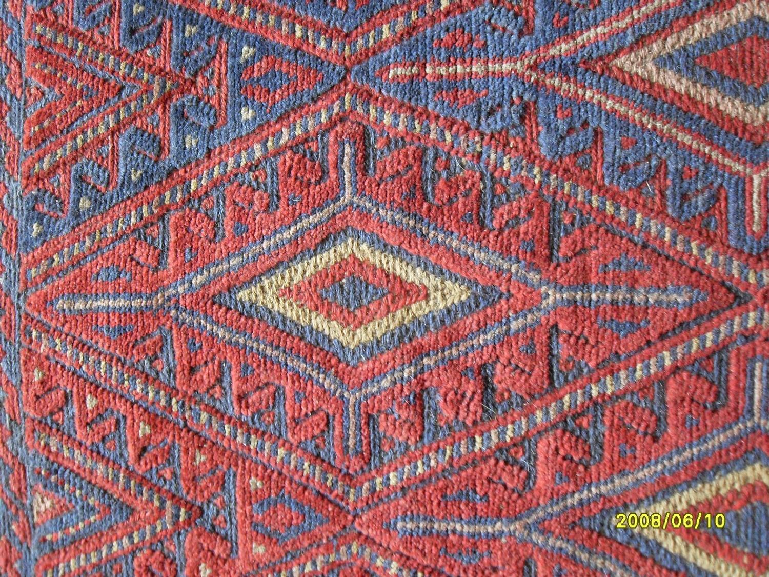 A Tajikistan hand-knotted tribal Gazak blue-ground rug with multicoloured isometric designs, - Bild 3 aus 3