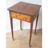 A Georgian mahogany square fold-out occasional table with frieze drawer on tapering legs terminating