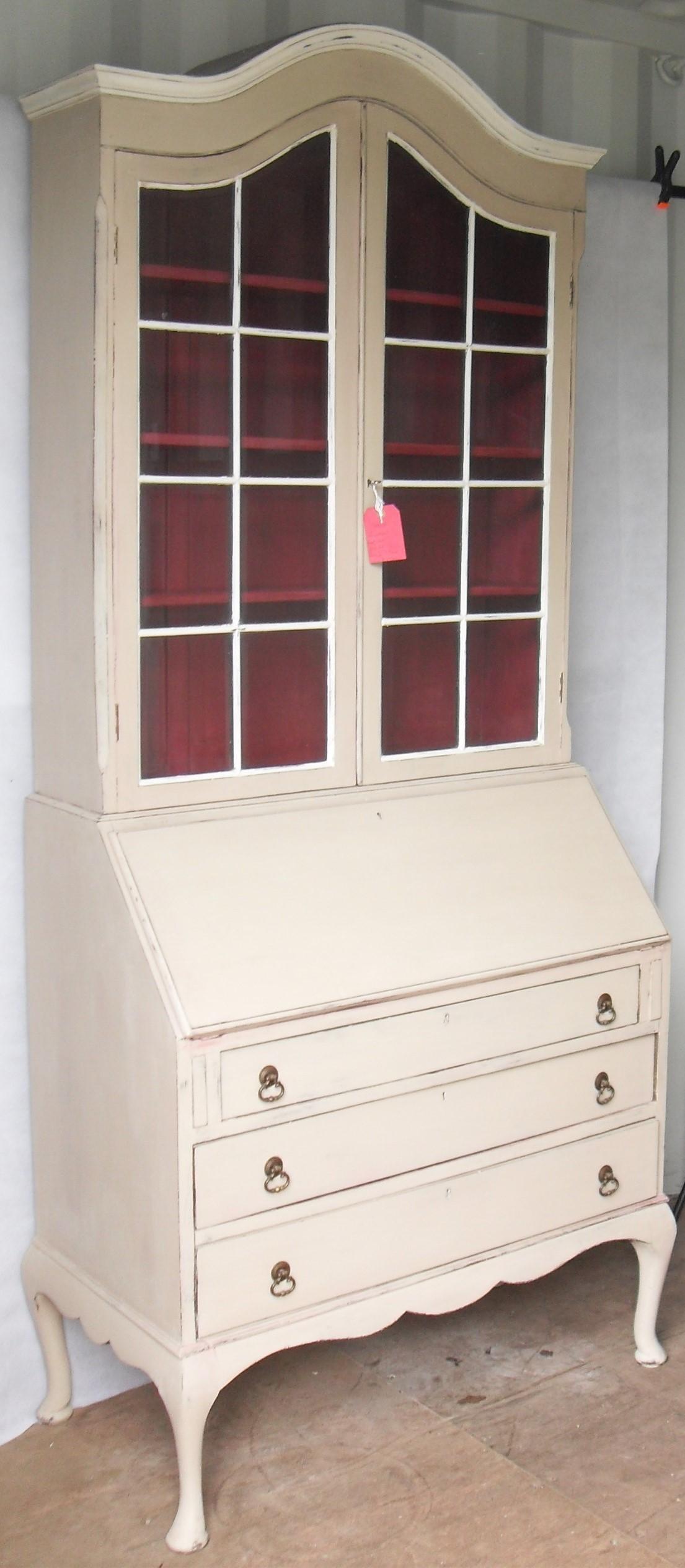A dome-topped painted bureau bookcase in the Georgian style with twin glazed doors revealing a