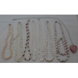 An assortment of seven faux pearl necklaces and a heart-shaped pendant (8)