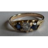 A Victorian sapphire and diamond three-stone ring centrally set with an off-round/cushion-shaped old