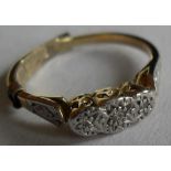 A diamond set three-stone 18ct gold and platinum ring comprising three 8-cut diamonds (1.7, 1.3, 1.