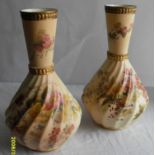 A pair of matching Royal Worcester blush ivory-ground vases with painted and printed floral