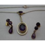 An amethyst pendant and chain with matching earrings, marked 9ct gold, 5g