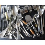 A broad assortment of silver plated flatware to include a basting spoon, salad servers, Royal