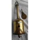 An early 19th century brass and clockwork spit jack with original key of typical bottle form, with