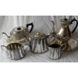 A three-piece silver plated tea service, a silver plated tea pot on tray and a silver plated