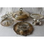 A selection of silver plated table ware to include a glass-lined circular tureen, table centres,