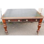 A Victorian mahogany rectangular writing table or desk with leather inset top, two frieze drawers