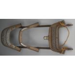 An early 1800's wood, brass, white and yellow metal camel saddle with etched decoration and Middle-