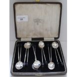 A set of six cased Sheffield silver coffee spoons with coffee bean terminals with six others (12) by