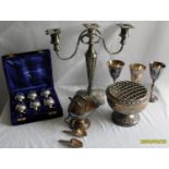 An assortment of silver plated table ware comprising a cased set of six coffee spoons, a two-