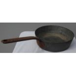 A 19th century copper pan with handle by Bennington