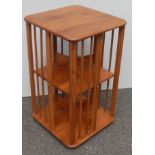 A retro oak-stained revolving bookcase with spindle supports, 76 x 45 x 45 cm