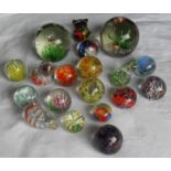 As assortment of nineteen millefiori and animal-shaped glass paperweights, all in good condition