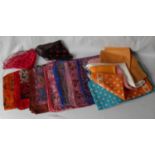 A selection of approximately fifteen silk ladies scarves is an array of styles and colours