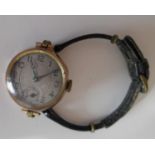 A lady's 9ct gold cased trench-style wristwatch with silvered dial (25 mm diameter), Arabic