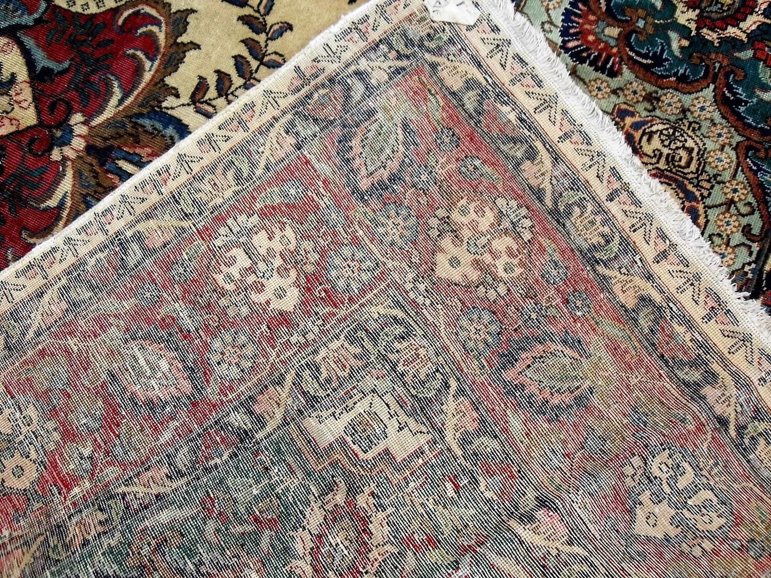 A Tabriz hand-knotted ivory-ground wool rug with multi-coloured floral and foliate designs, burgundy - Image 3 of 3
