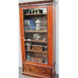 A Victorian mahogany single glazed door bookcase with cavetto cornice, shelved interior (adjustable)