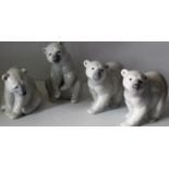 Four Lladro figurines of polar bears, all without damage or repair
