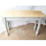 A rustic pine console table with painted frieze and turned legs, 77 x 116 x 39 cm