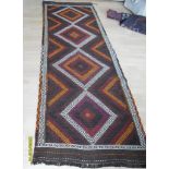 A Persian hand-knotted Suzni Kilim multicoloured wool runner with single border and short fringe, 78