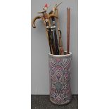 A cylindrical ceramic multi-coloured stick or umbrella stand, 46 cm H