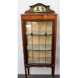 An Art Nouveau mahogany display cabinet with mirror tray-back, floral marquetry to frieze, single