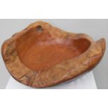 An artisan carved elm free-form bowl, 22 H x 54 cm W