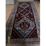 A Persian hand-knotted thick-pile Hamadan shiraz-ground wool runner with multicoloured animal