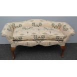 A recently re-upholstered Victorian-style walnut window seat on cabriole legs and shell scroll